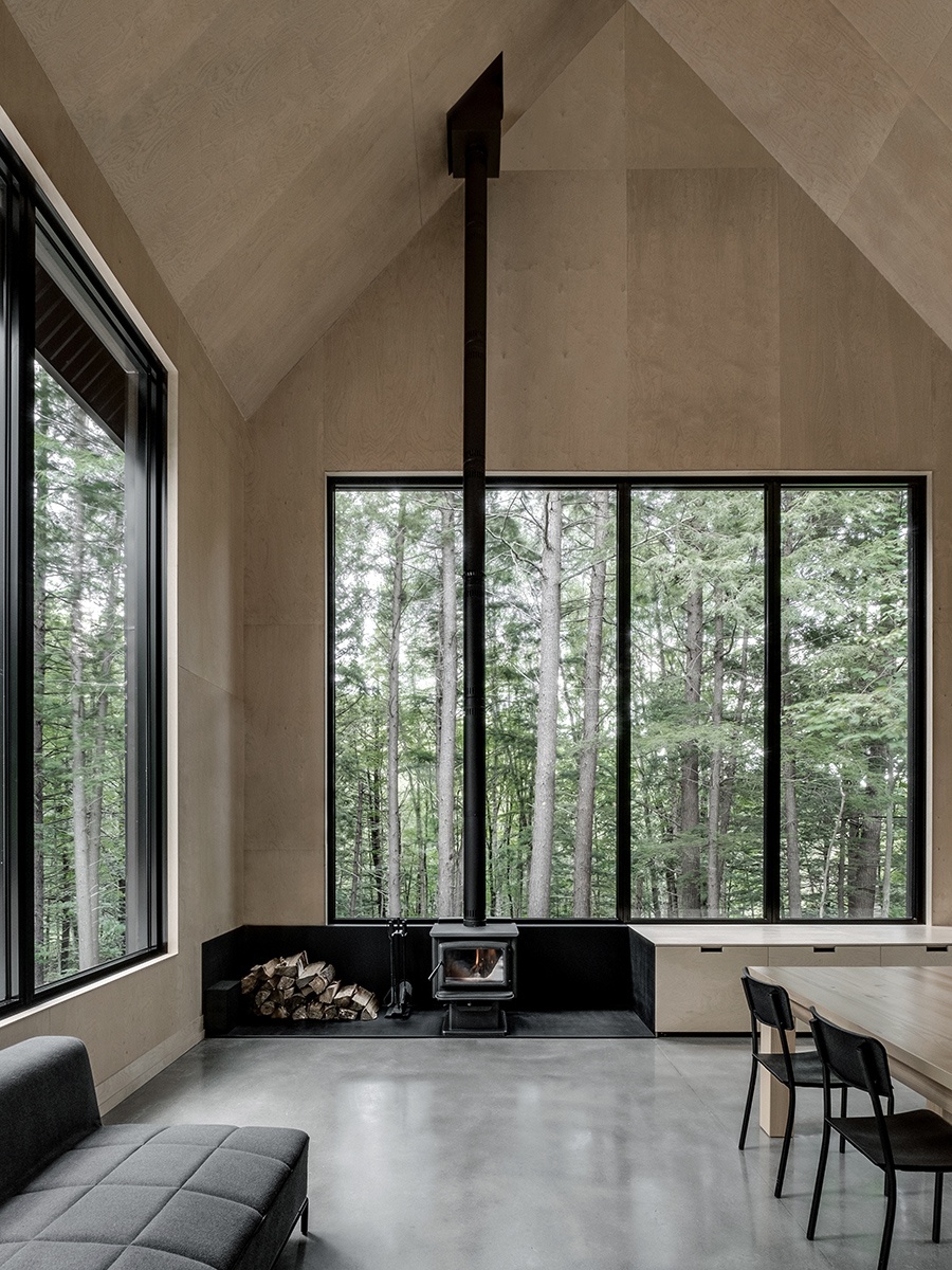 interior with large windows looking out to forest