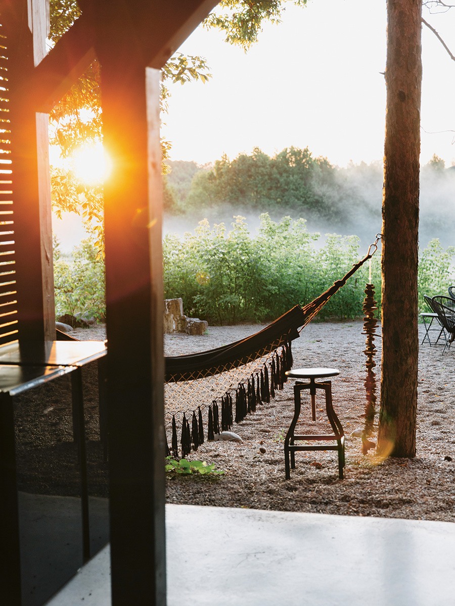 hammock in the sun with misty green space beyond