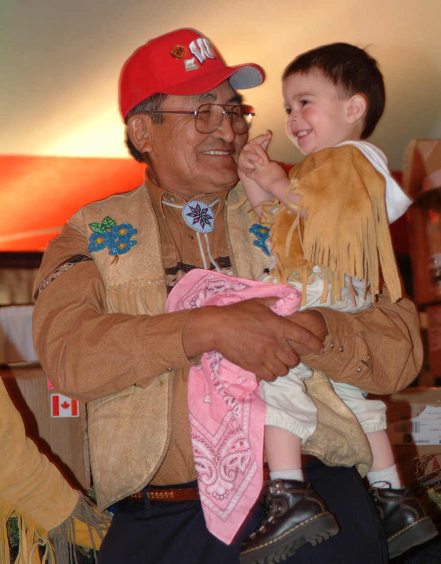 Elder holding a laughing child