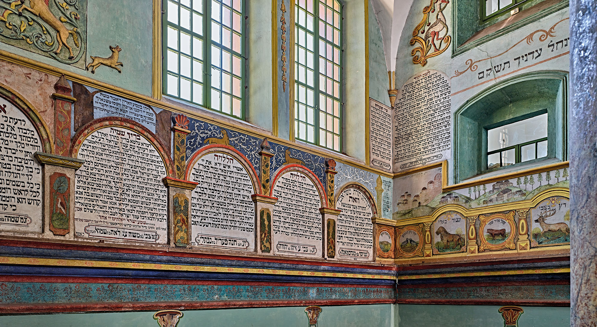 Hebrew prayers and biblical animals adorning the walls of the restored synagogue, Łańcut, Poland, 2012