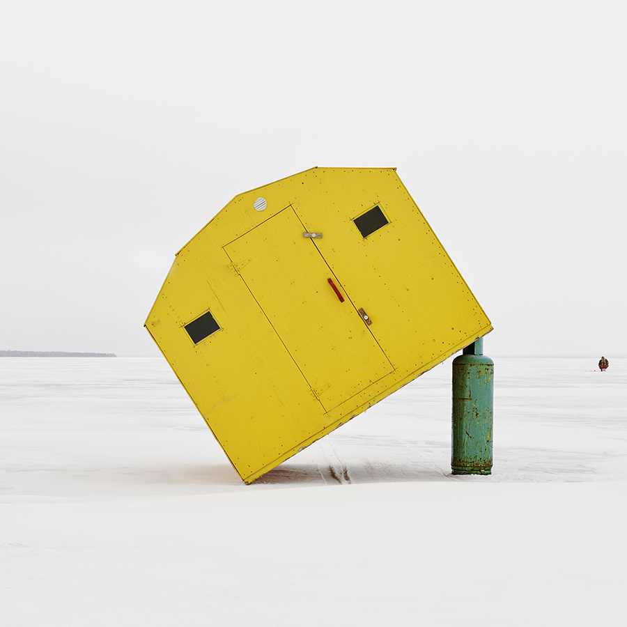 Yellow fishing hut tipped at an angle