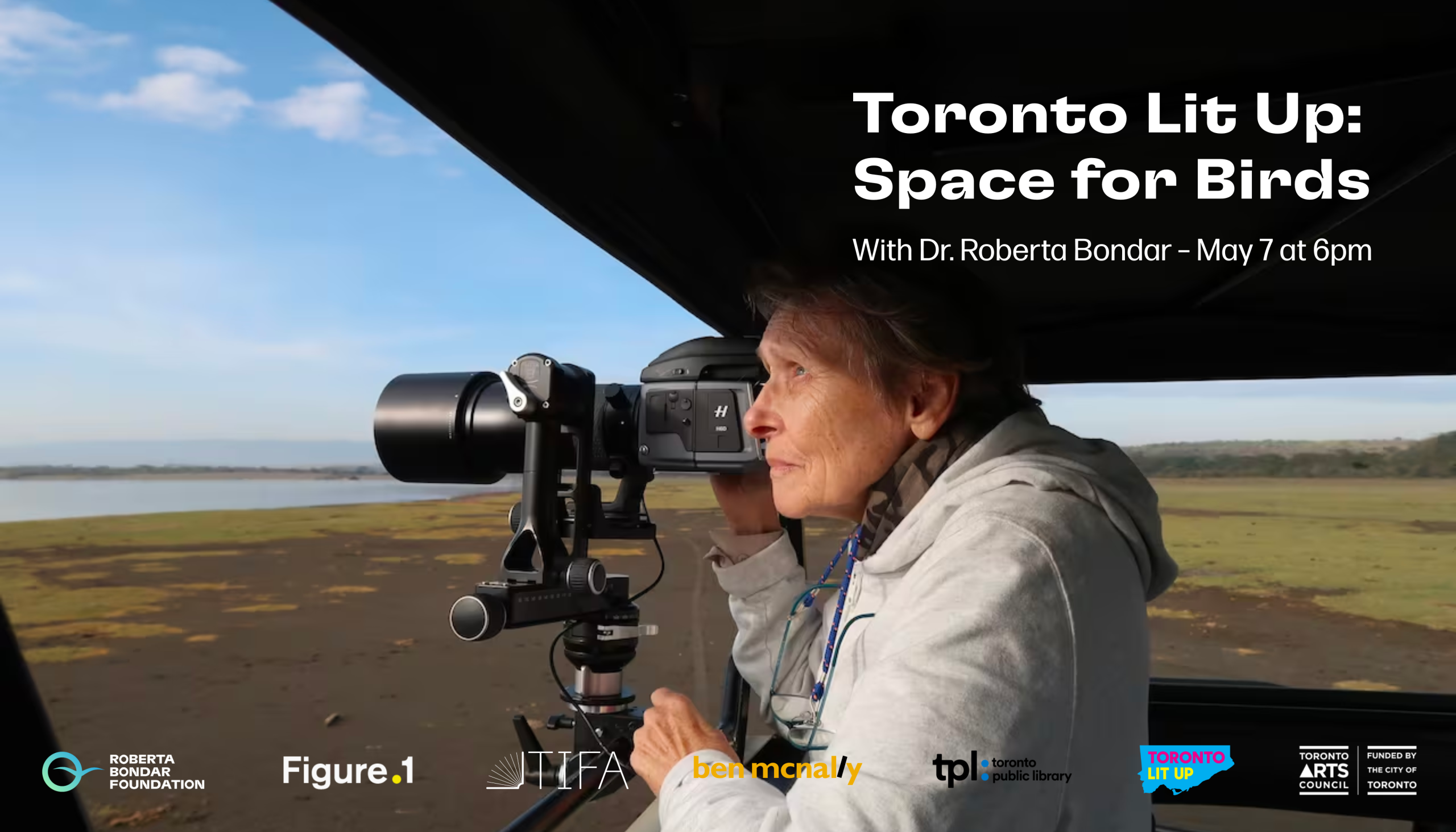 Side view of Roberta Bondar looking through a camera viewfinder